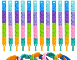 Set di 12 braccialetti pop it in silicone colorati per un efficace sollievo dallo stress.