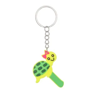 Cute cartoon turtle keychain with a green letter I, made from durable PVC material