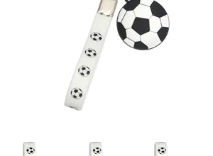 Macro view of soccer ball pendant and silicone strap for sports themed keychain