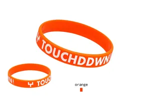 Vibrant orange football silicone wristband featuring white TOUCHDDWN text detail