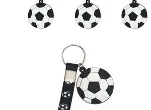 Macro view of soccer ball keychain featuring silicone strap for sports themed party gifts