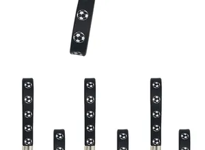 Detailed macro view of flexible black silicone keychains with printed soccer ball patterns