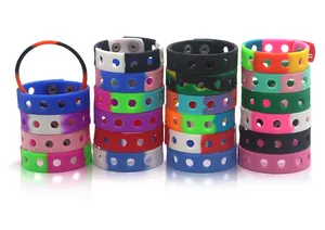 Stacked colorful adjustable silicone wristbands with hollow design and snap buttons