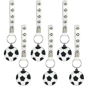 Set of six soccer ball silicone keychains with printed wrist straps for party favors
