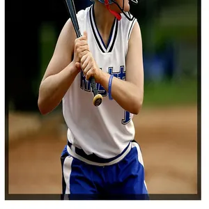 Close-up of a durable blue softball silicone wristband worn by an athlete holding a bat