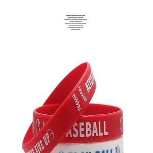 Detailed macro view of red silicone baseball wristband featuring Never Give Up printed text