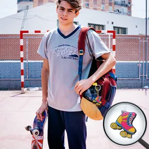 Colorful cartoon PVC roller skate keychain pendant displayed in a sports lifestyle setting