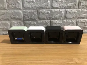 Rear view of minimalist cube alarm clocks showing the battery compartment design