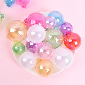 Close-up of iridescent rainbow decorative balls on a white plate for cake topper