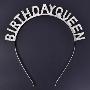 Close-up of rhinestone 'BIRTHDAY QUEEN' lettering on silver metal headband tiara.