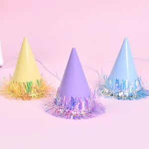 Detail view of mini pet party hats with colorful iridescent tinsel fringe decor