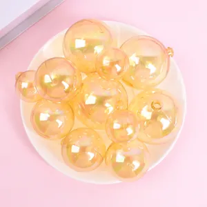Close-up view of shimmering iridescent golden sphere cake toppers in various sizes