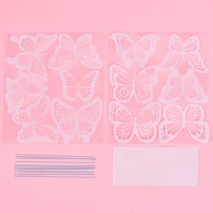 Detailed set of iridescent butterfly cake toppers with support sticks and adhesive dots
