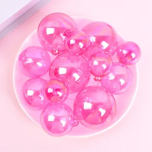 Close-up of pink iridescent decorative spheres for cake topping and party decor.