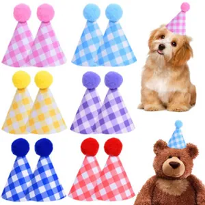 Detail view showing a variety of colorful checkered pet party hats with soft pompom decorations.