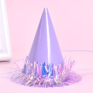 Detailed view of a mini purple party hat with iridescent tinsel fringe decoration