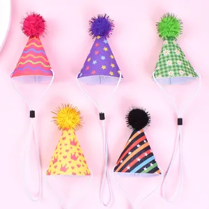 Close-up detail of colorful printed pet birthday hats with adjustable elastic straps