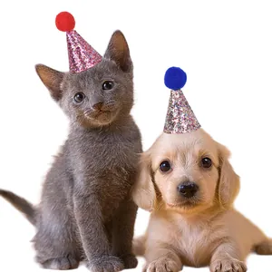 Set of glitter cone hats for cat and dog birthday party decorations with pom poms.