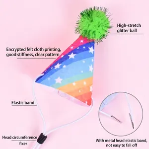 Detail view of rainbow pet birthday hat with adjustable elastic strap and tinsel pom-pom.