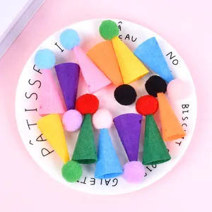 Detailed view of colorful miniature felt party hats with soft pompoms for small pets