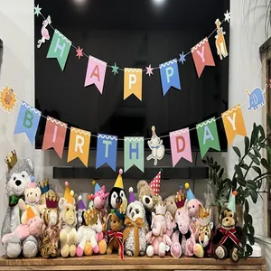 Detail of various colorful pet birthday hats on plush models with festive banner