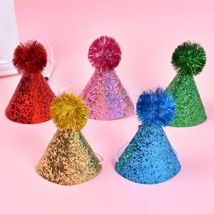 Detail view of five glittery pet birthday hats in various colors with tinsel poms