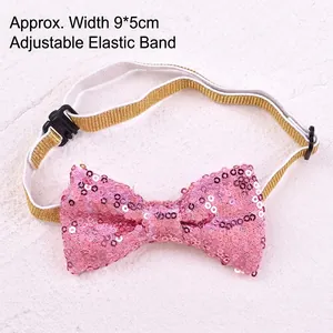 Close-up view of a pink sequined pet bow tie featuring an adjustable gold elastic band
