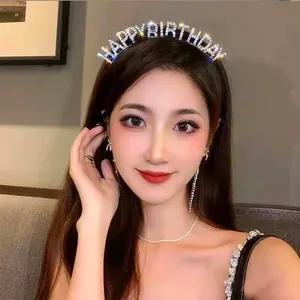 Elegant woman wearing a sparkling rhinestone HAPPY BIRTHDAY headband for a party.