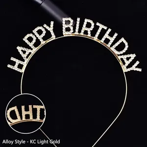 Detailed macro view of gold alloy headband with sparkling rhinestone Happy Birthday lettering.