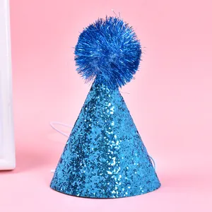 Blue glitter party hat for dogs and cats featuring a fluffy pom-pom and elastic strap.