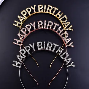 Close-up of three rhinestone Happy Birthday headbands in gold, rose gold and silver