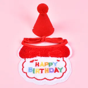 Close-up view of red pet birthday bib and hat with colorful Happy Birthday embroidery