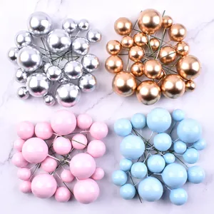 Close-up of 20pcs gold silver pink and blue assorted sizes foam ball cake toppers set