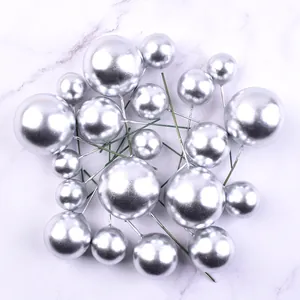 Close-up of 20pcs silver foam ball cake toppers in various sizes for baking decor
