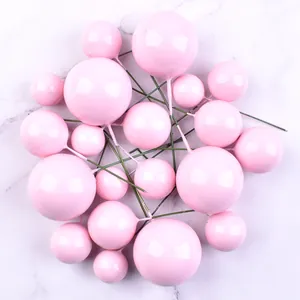 A detailed view of pink foam balls in various sizes for cake toppers and decoration