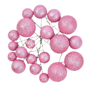 Pink glitter ball cake toppers in various sizes for birthday dessert decoration