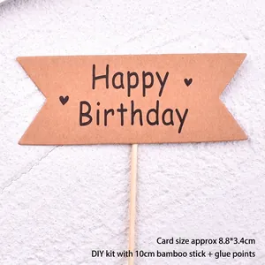 Detail view of kraft paper Happy Birthday cake topper with dimensions 8.8x3.4cm