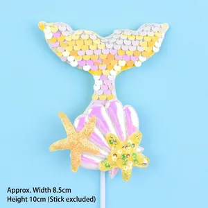 Detailed view of iridescent mermaid tail cake topper with starfish, shell, and dimensions