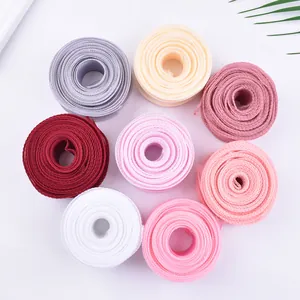 Macro view of 4cm fish tail mesh ribbons in multiple colors for floral gift wrapping