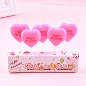 Detailed view of pink heart-shaped birthday candles 5-pack for cake decorations