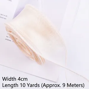 Macro view of 4cm cream wavy edge organza ribbon for floral and gift packaging
