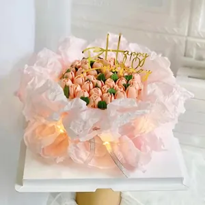 Detail of pink pear tissue paper used for cake bouquet wrapping with lights.