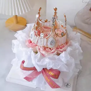 Elegant white Sydney paper used for wrapping a floral bouquet with a crown topper.