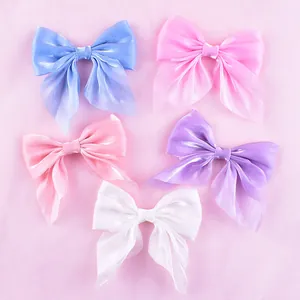 Set of assorted mesh fabric bow cake toppers in five colors for baking decoration