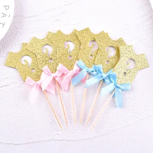 Glitter onesie cupcake toppers with pink and blue bows for gender reveal party decorations