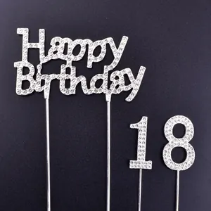 Macro detail of sparkly silver rhinestone Happy Birthday and 18 birthday cake toppers