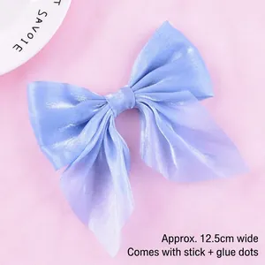Detail showing 12.5cm iridescent mesh bow topper for cake decoration