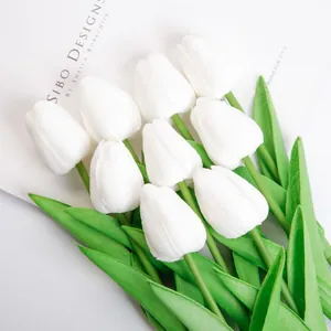 Close-up view of elegant white artificial tulips used for cake decoration and toppers