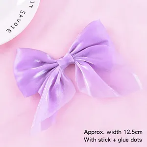 Detailed view of 12.5cm purple organza bow cake topper with stick and glue dots
