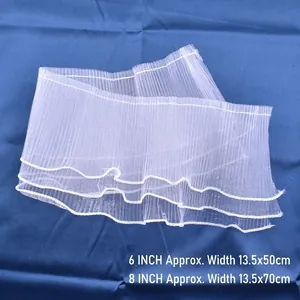 Macro view of white pleated mesh ribbon used for elegant cake decoration borders